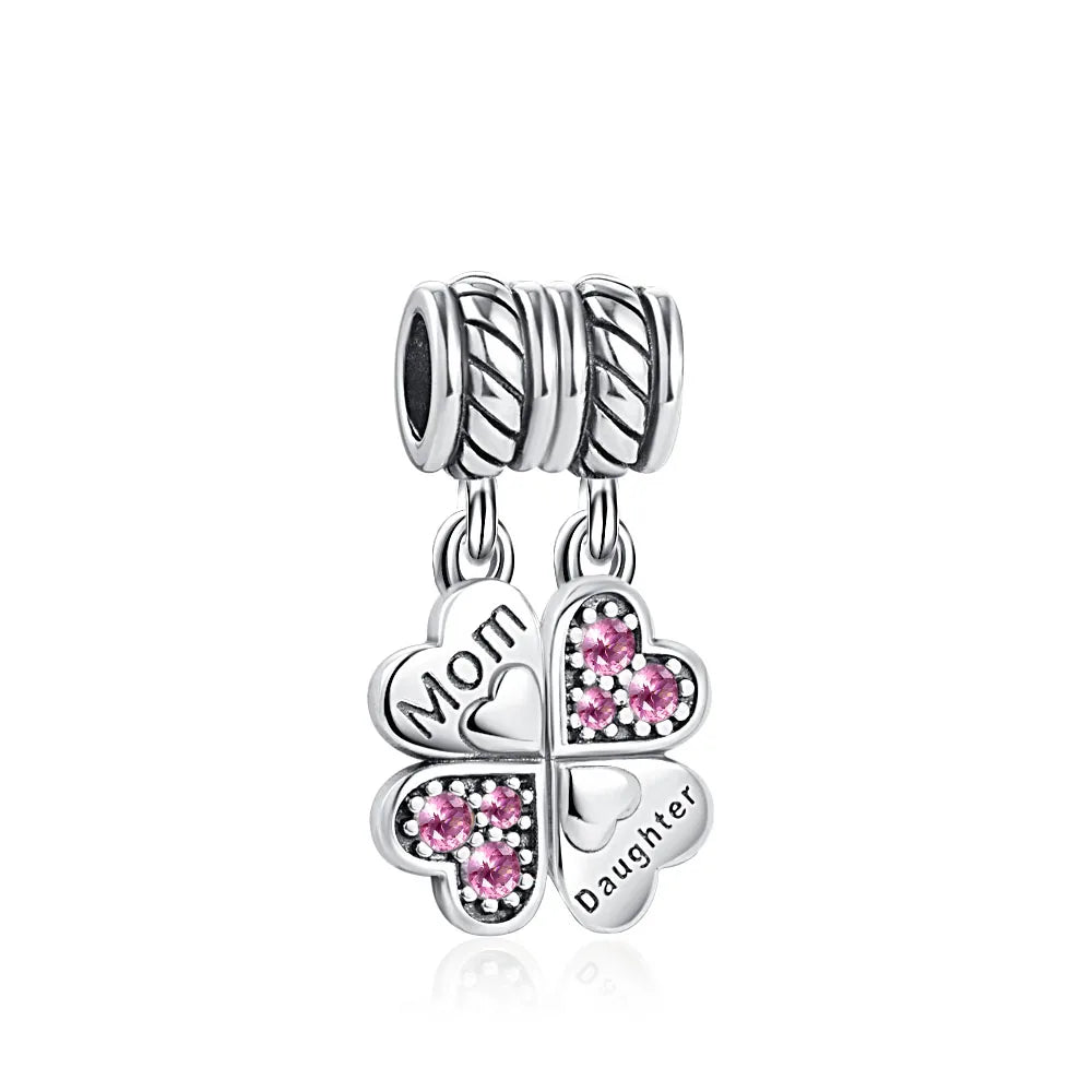 Celebrate family love with 925 Sterling Silver charm pendants featuring boy, girl & mom designs. Pandora compatible.